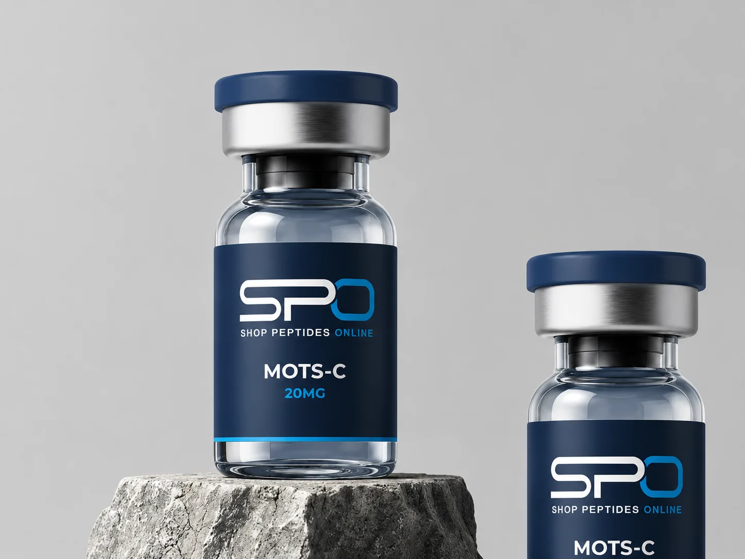 Two Shop Peptides Online MOTS-C research vials displayed on a stone plinth